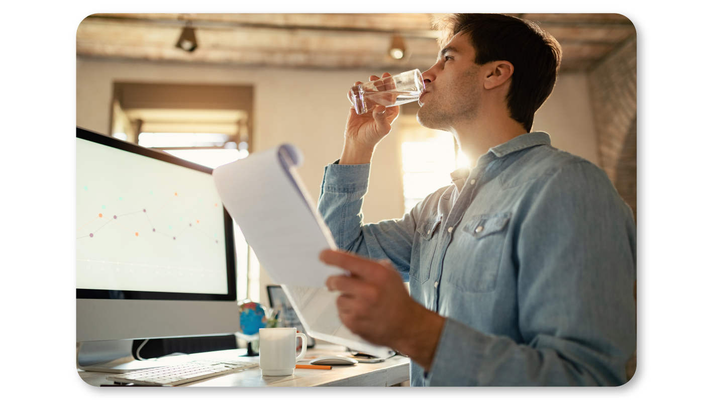 An Employee Practices Self Care At Work by Staying Hydrated