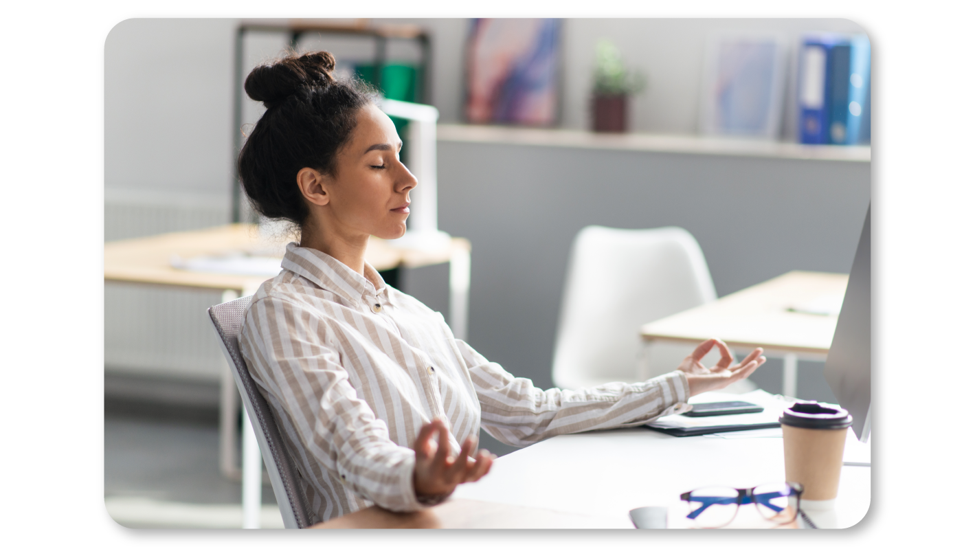 A Woman Practicing Mindfulness Exercises at Work through Beginner Friendly Mindfulness Meditation