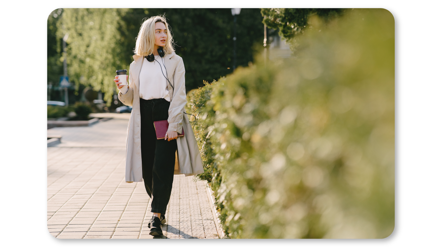 A Woman Practicing Mindfulness Exercises at Work by taking a Stroll outside to Unplug herself