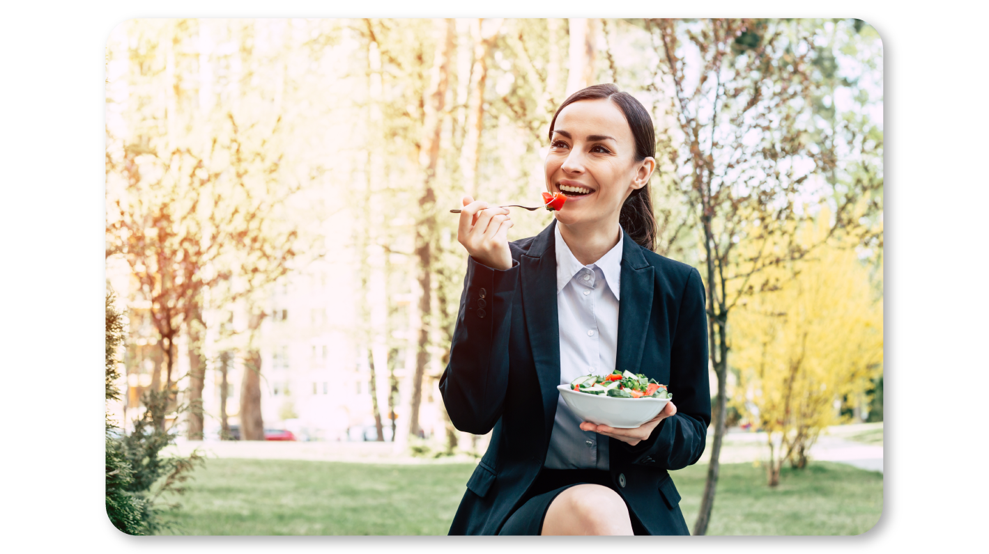 A Woman Practicing Mindfulness Exercises at Work through Mindful Eating