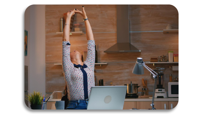 Employee doing desk yoga to stretch