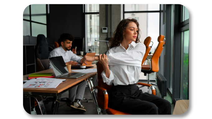 Employee doing desk yoga while at work