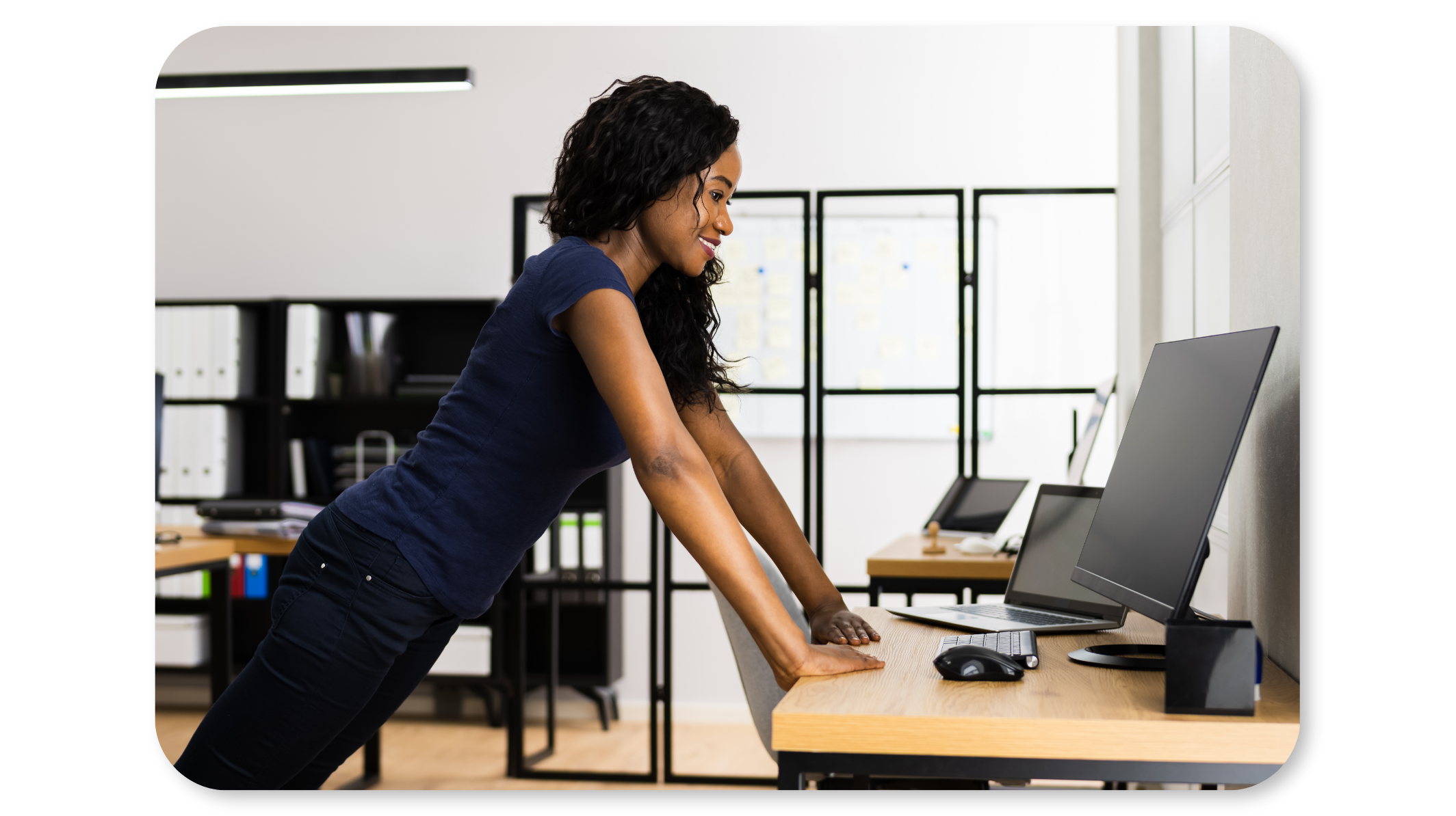 Employee practises desk chaturanga