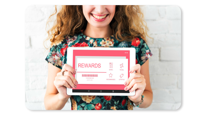 A Happy Employee reaping the Benefits of getting Gift Cards as Wellness Rewards